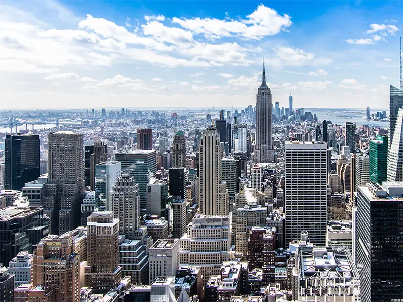 A city showing high rise buildings and blue sky