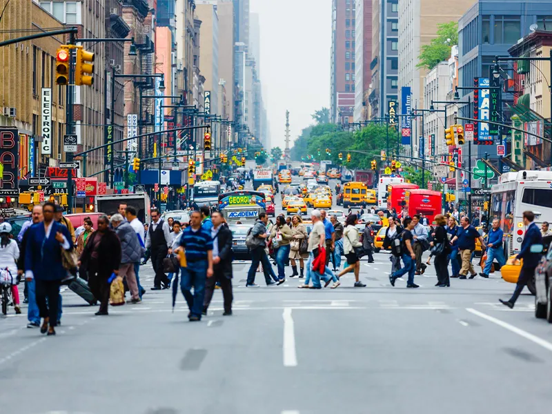 Urban infrastructure showing many people on the street of a busy city for smart city air monitoring potential